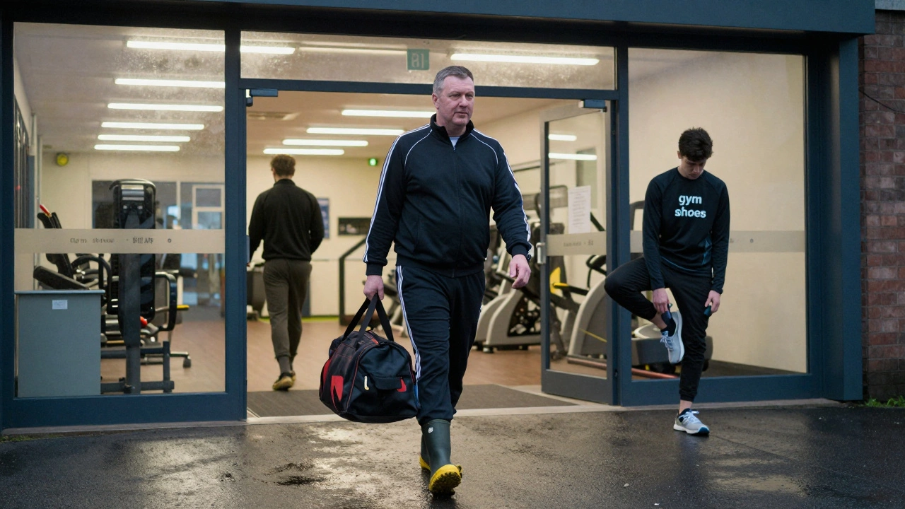 A man in tracksuit shoes entering a leisure center as a younger person adjusts their sneakers.